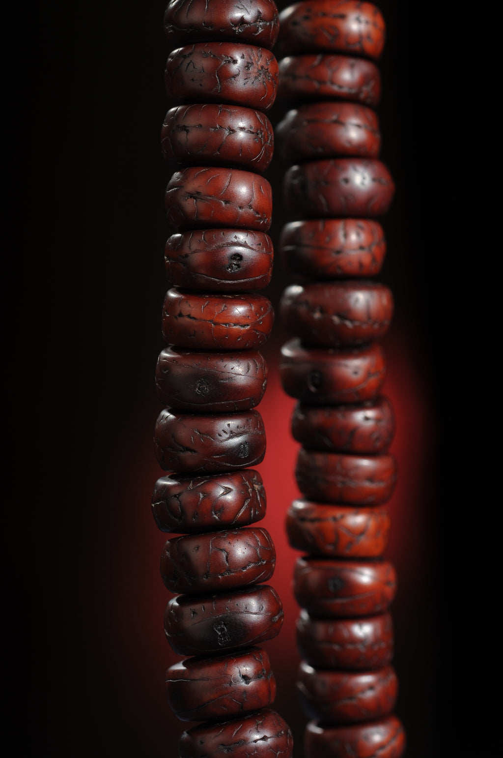 Vertical close view of source-described old phoenix eye bodhi mala beads