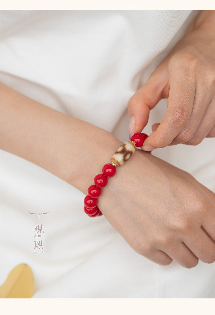 Fantan red glass bracelet worn on wrist