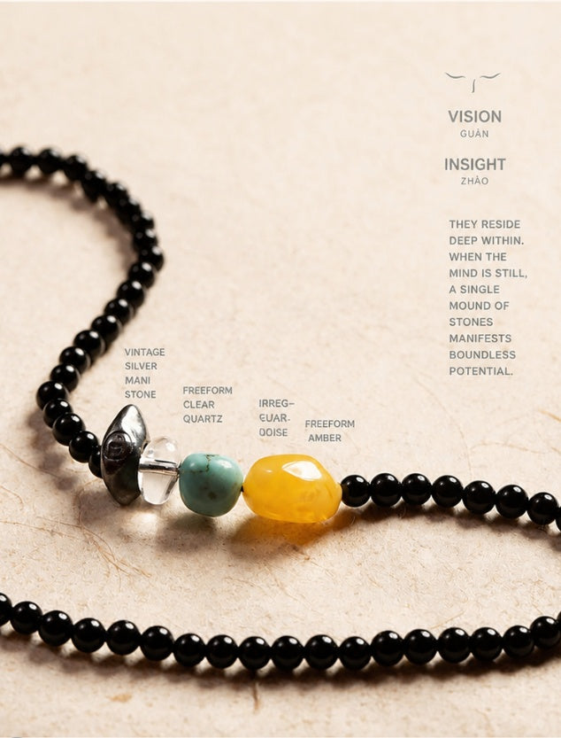 Black agate necklace with freeform amber, turquoise, clear quartz, and aged silver detail