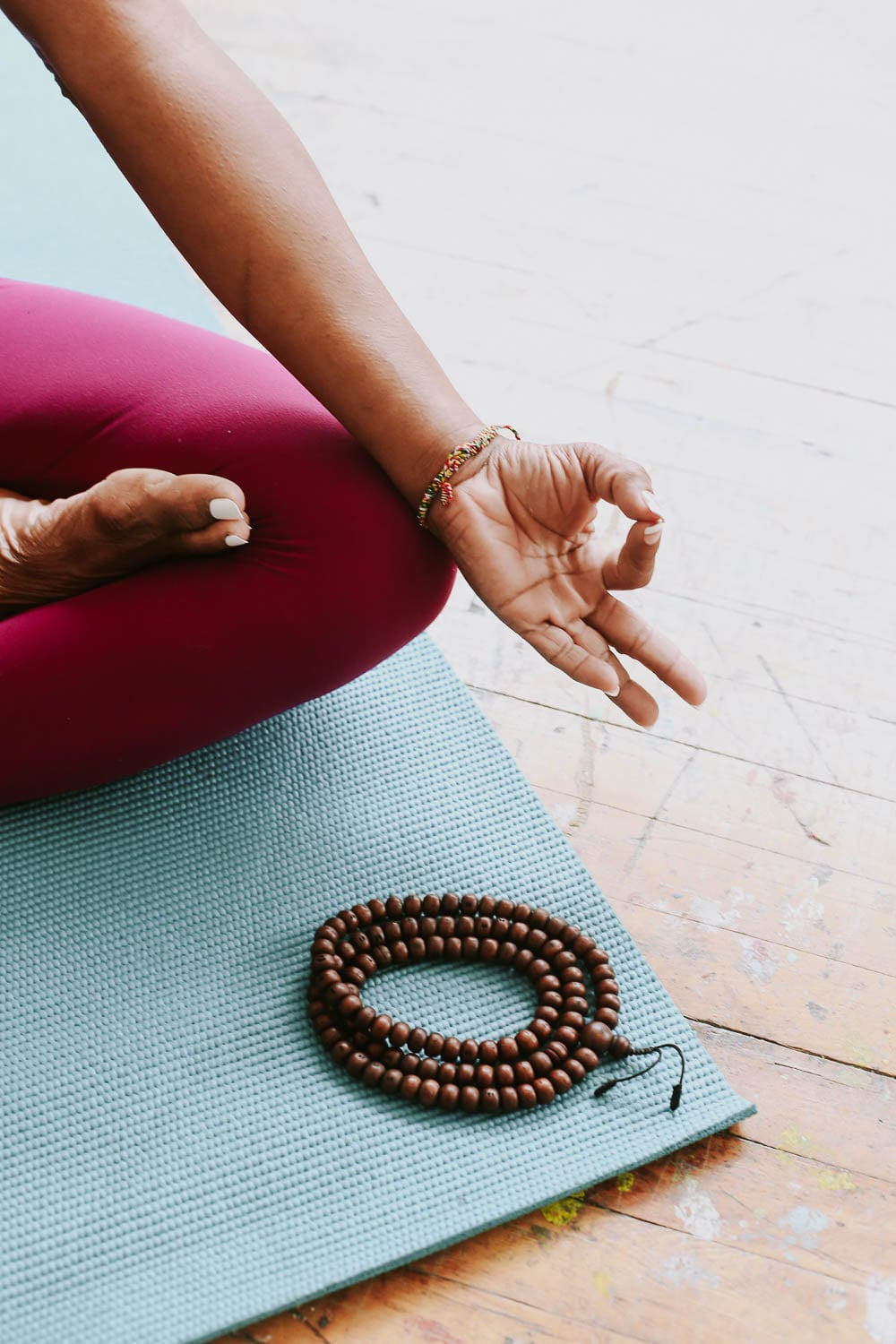 Dark bodhi seed mala on a meditation mat