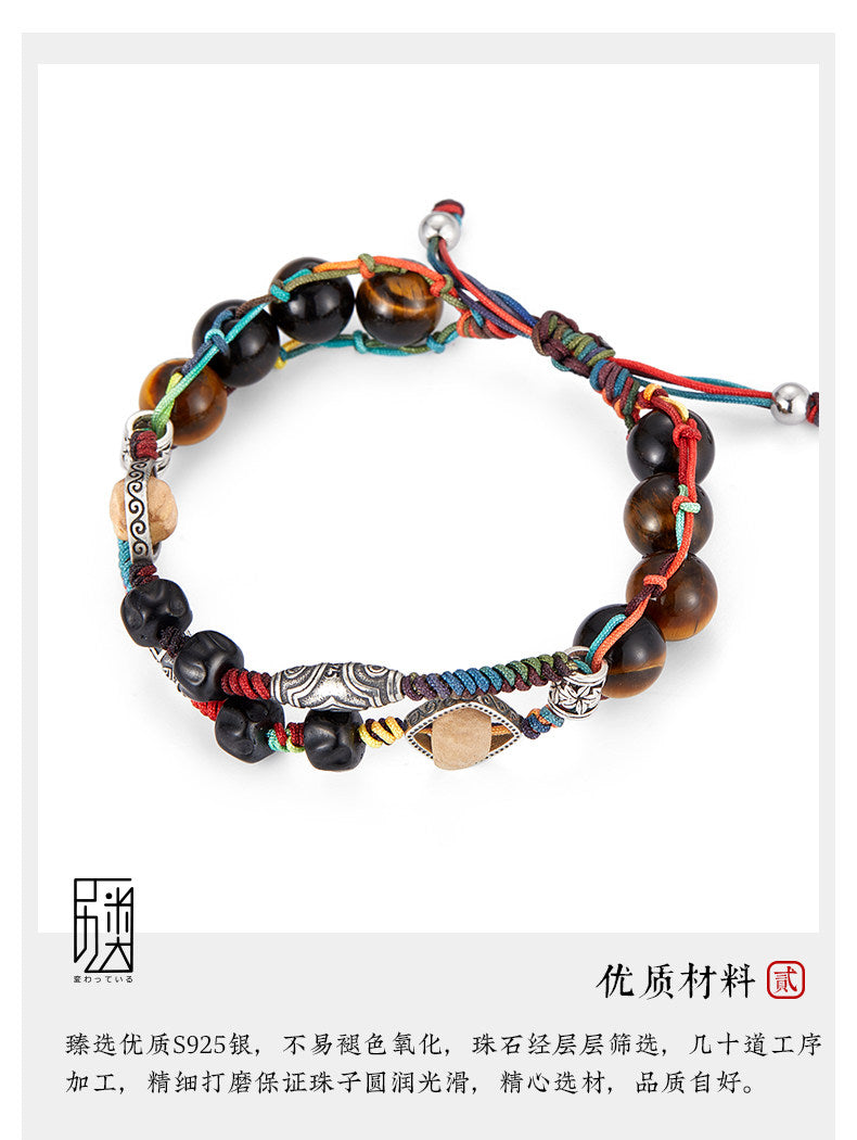 Anlan woven bracelet with tiger eye beads, dark seed beads, S925 silver accents, and multicolor cord