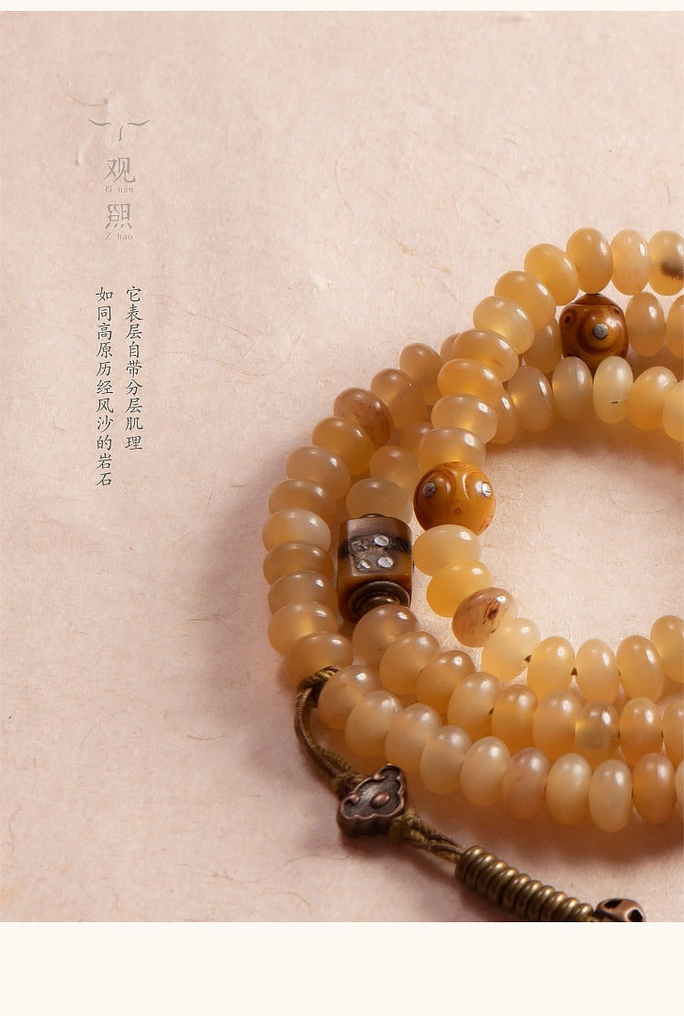 Coiled sheep horn 108 mala with metal and cord accents