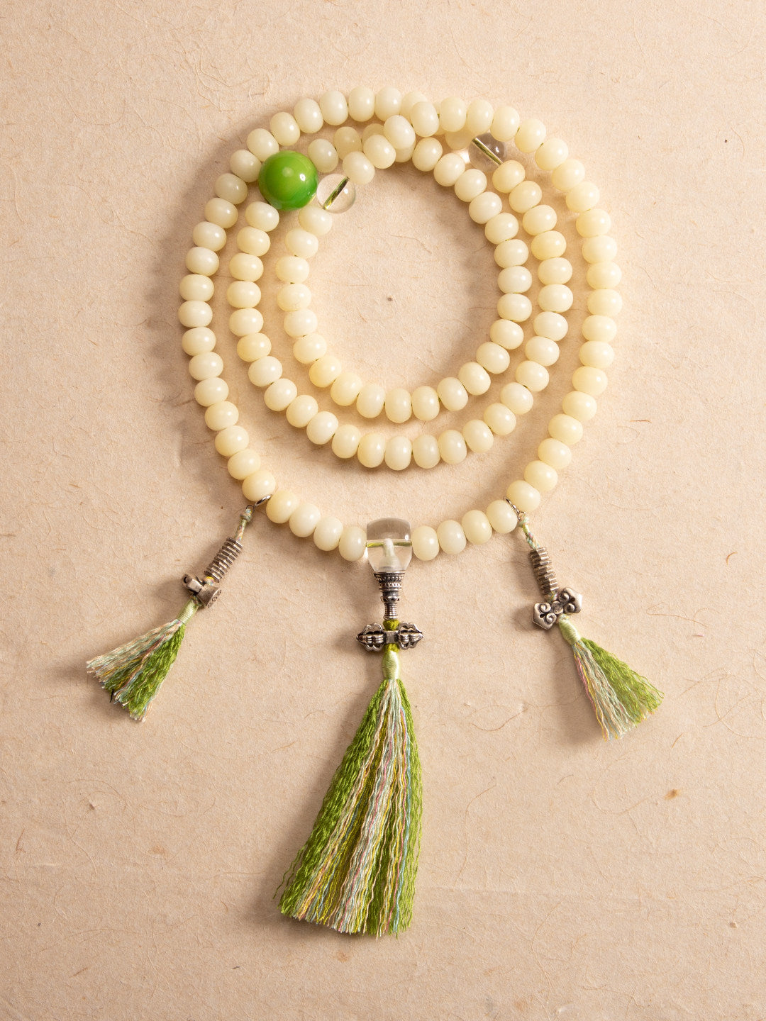 Bosaman Guanzhao white bodhi 108 mala coiled with green tassel and accent bead