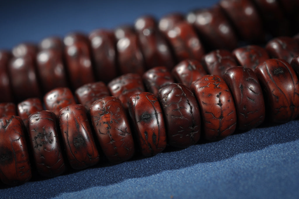 Phoenix eye bodhi 108 bead mala showing natural dark markings